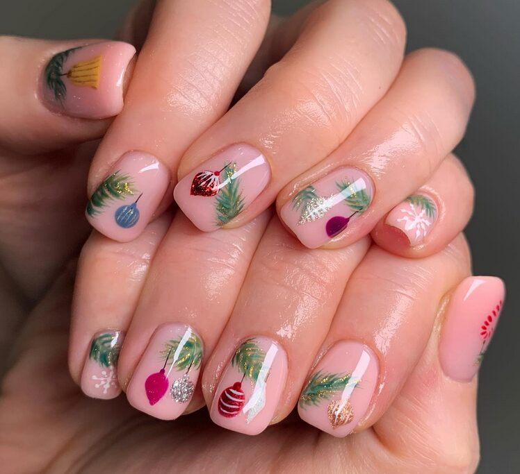 Clear base nails with black minimalist Christmas tree silhouette outlines and tiny silver star toppers