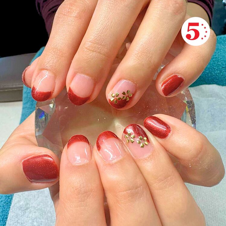 red Christmas nails with gold accents