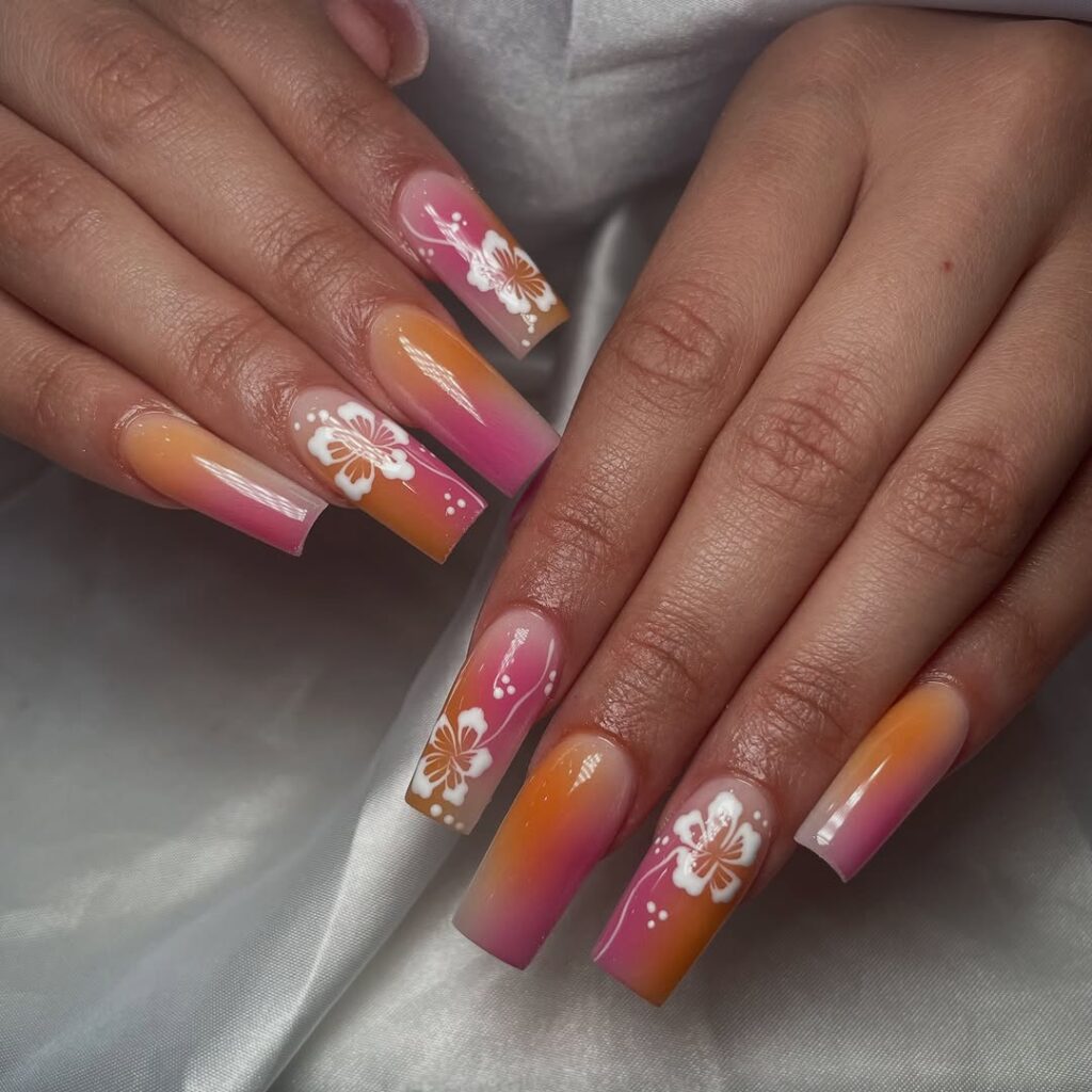 Ombre sunset nails with hand-painted hibiscus florals