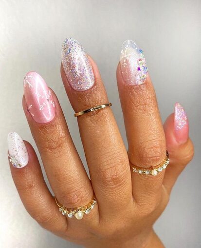 Close-up of hands with a mix-and-match snowflake nail design