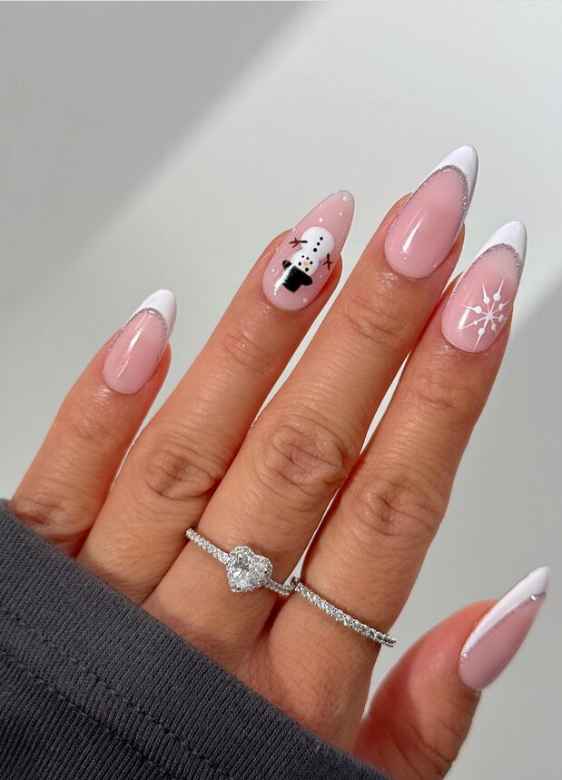 White winter nails featuring a classic snowman design