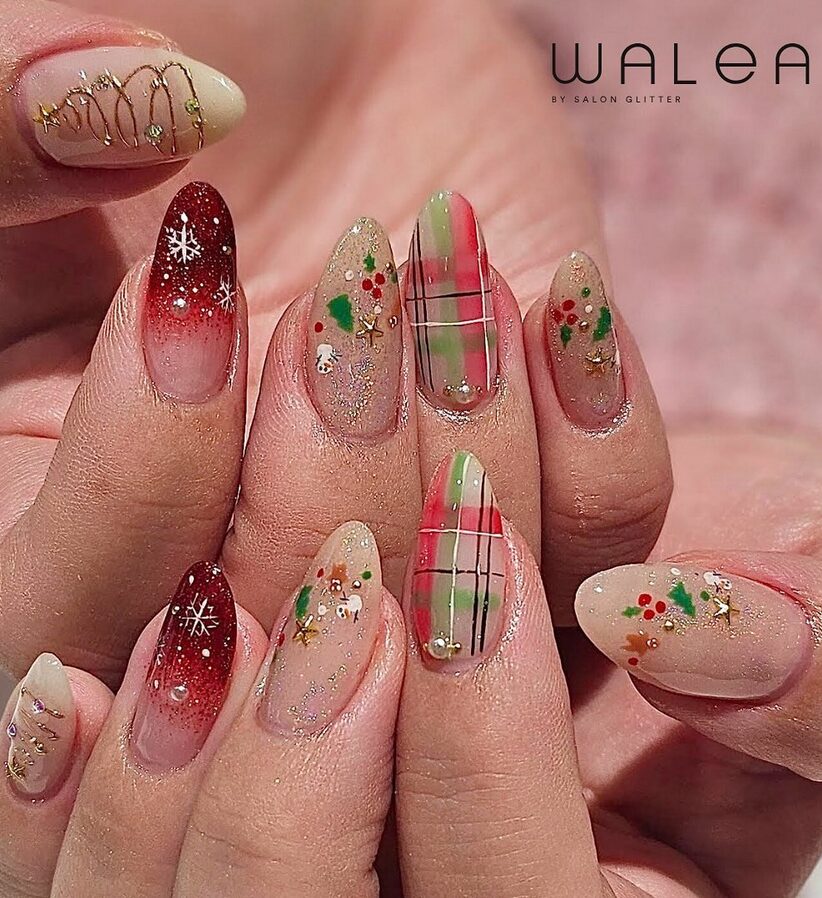 Nude nails with tiny minimalist snowman faces.