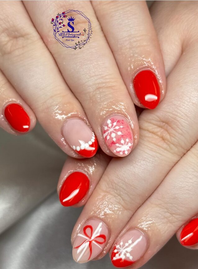 Red Christmas nails with white snowman accents