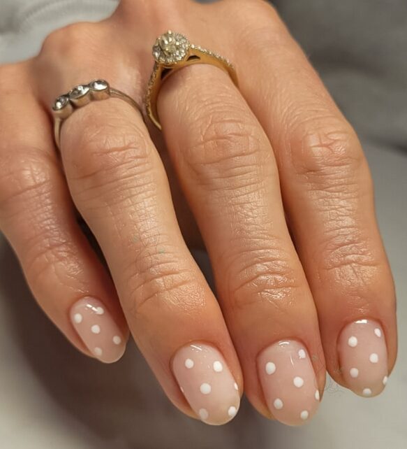 white polka dot manicure