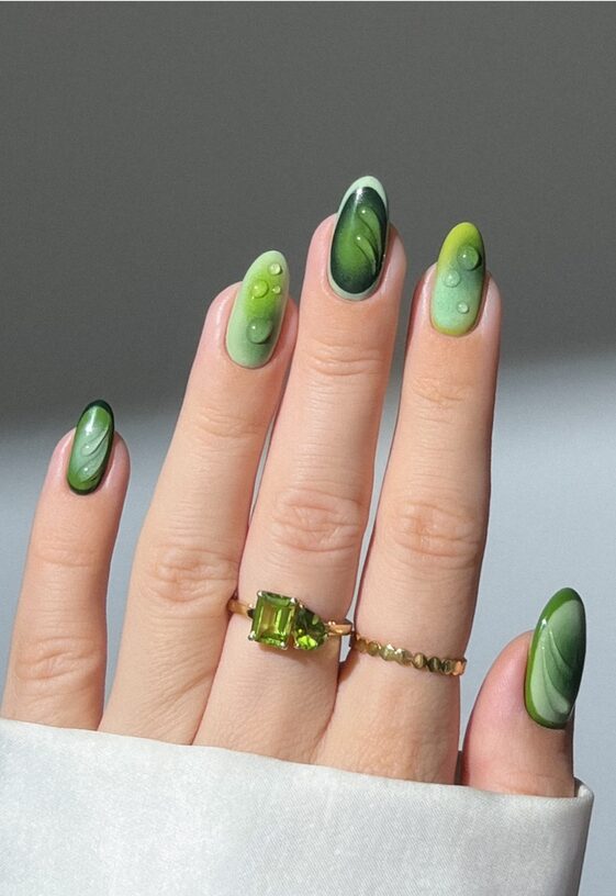 soft gradient forest green nails with gloss finish