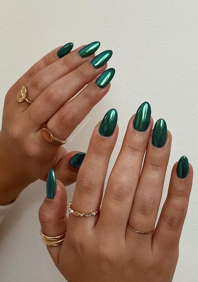 Almond nails with mirror-like emerald green chrome finish
