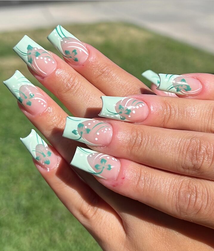 Neutral base nails with sage green French tips