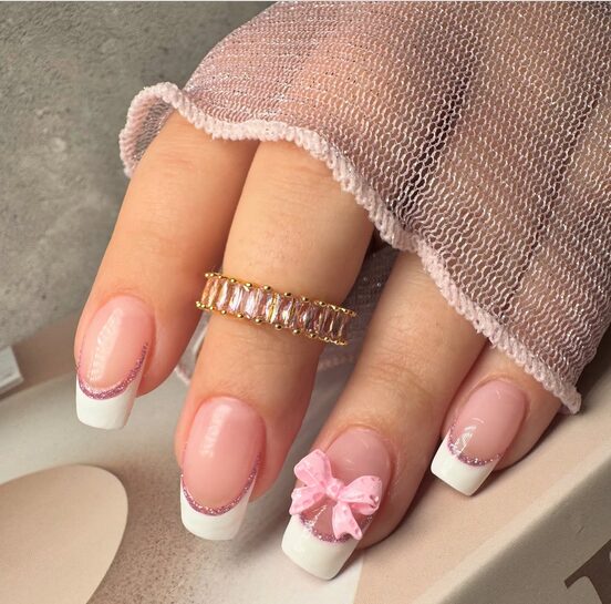 French tip nails with delicate mini bow accents