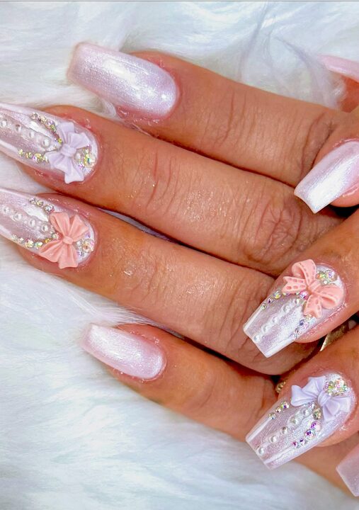 Pastel nails with large 3D pearl bow