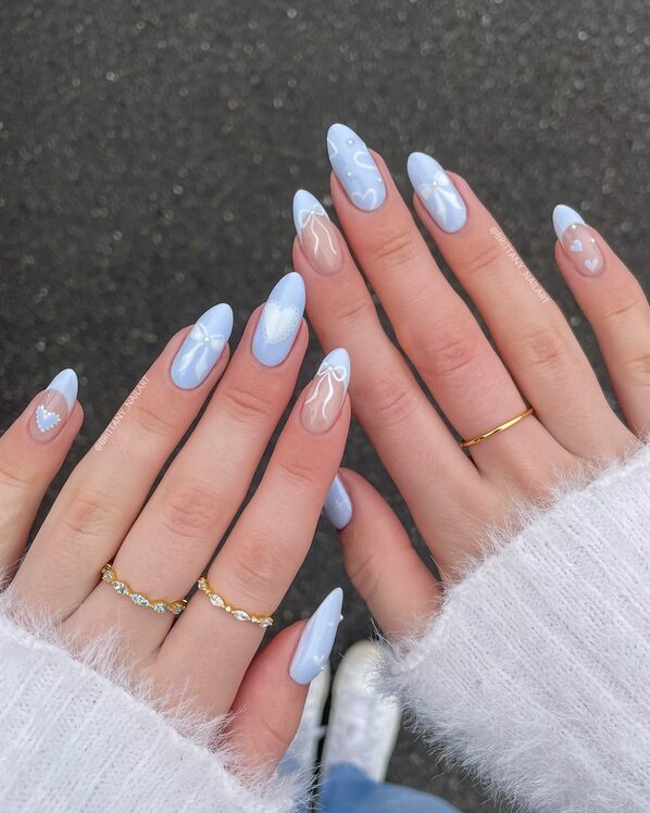 Baby blue nails with heart & bow artwork