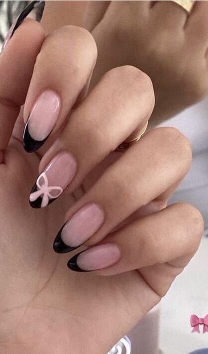 Black gothic nails with lace and bow accents