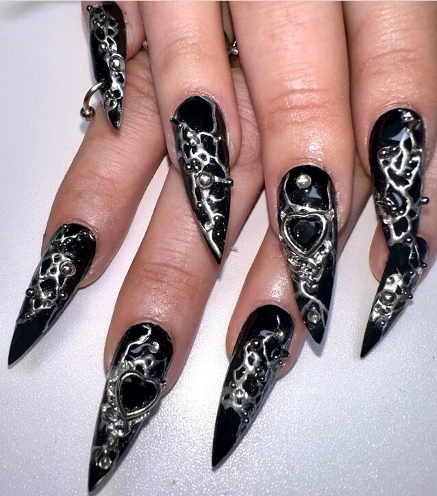 Matte black grunge nails with a dark minimalist finish