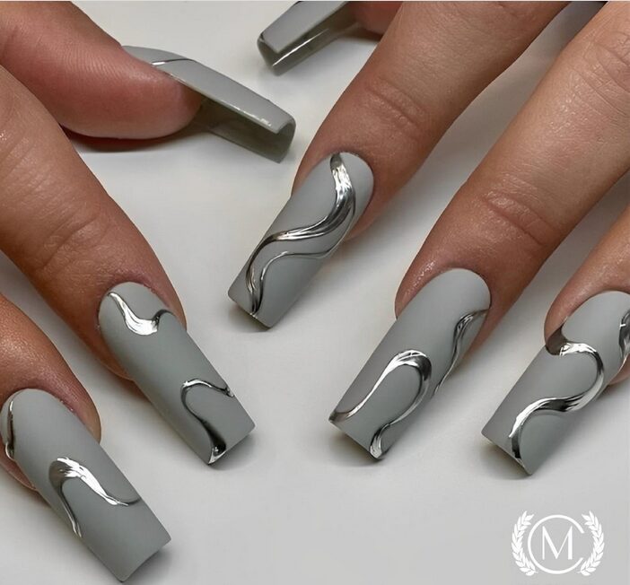 Grey nails with minimalist silver line art design.