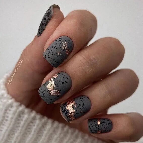 Concrete textured grey nails with rough matte surface.