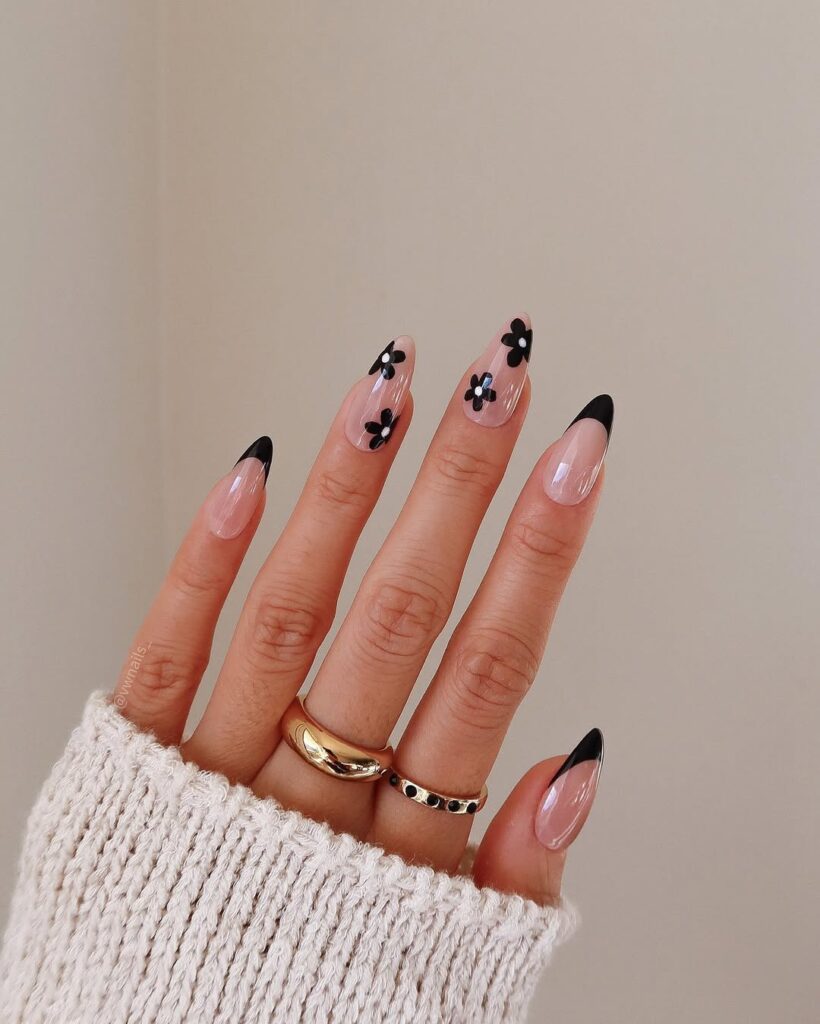 ink nails with black French tips and delicate flower details for spring