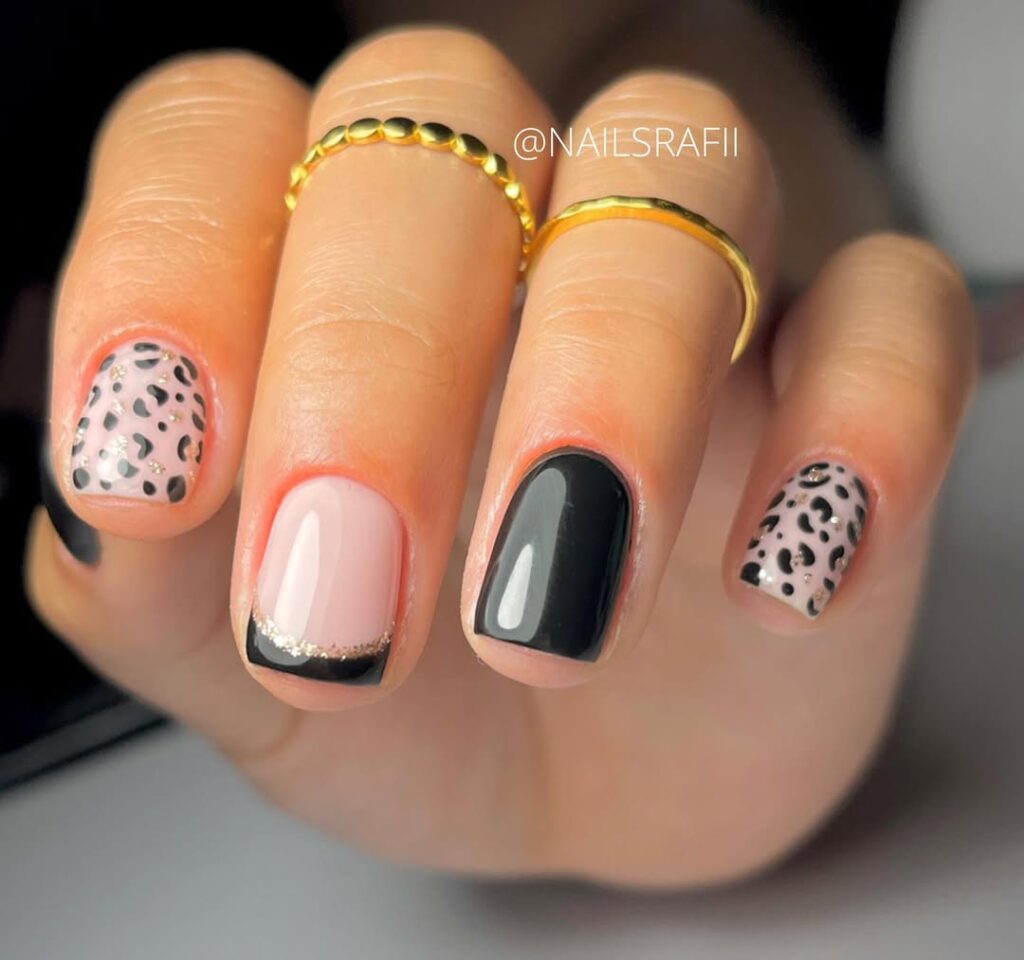 Black and pink nails with leopard print and gold French tips