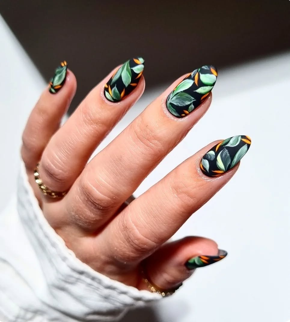 Black spring nails with green leafy botanical design