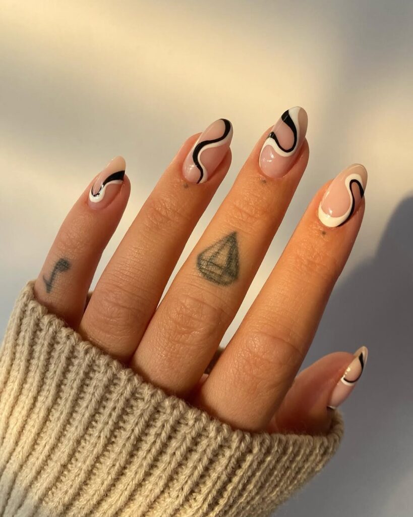 nails with black and white abstract swirl designs