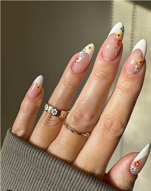 white french tip nails with tiny spring flower accents