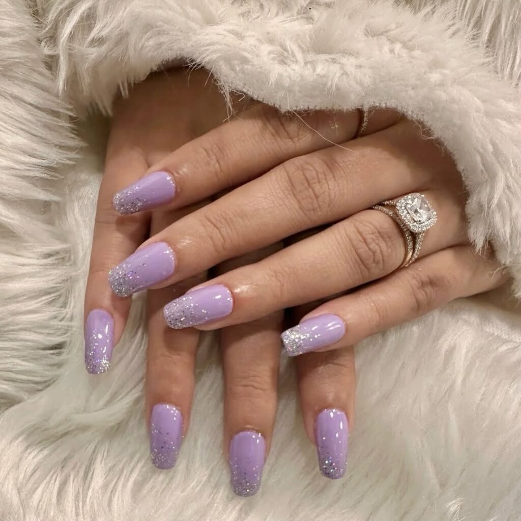 long lavender nails with silver glitter ombre tips