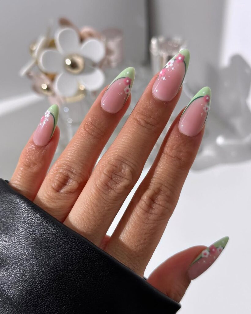 nails with mint green French tips and tiny pink floral details