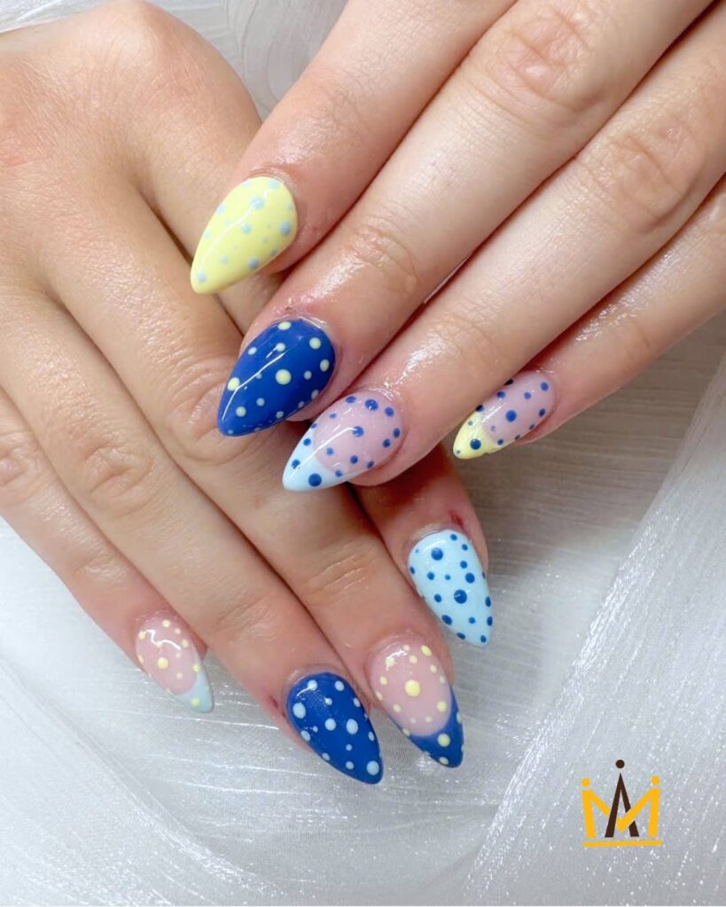 polka-dot combo of pastel yellow, bold blue, and soft pink nails