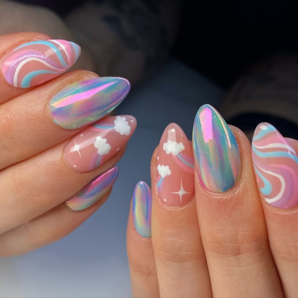 nails with rainbow chrome finish, pastel swirls, and cloud accents