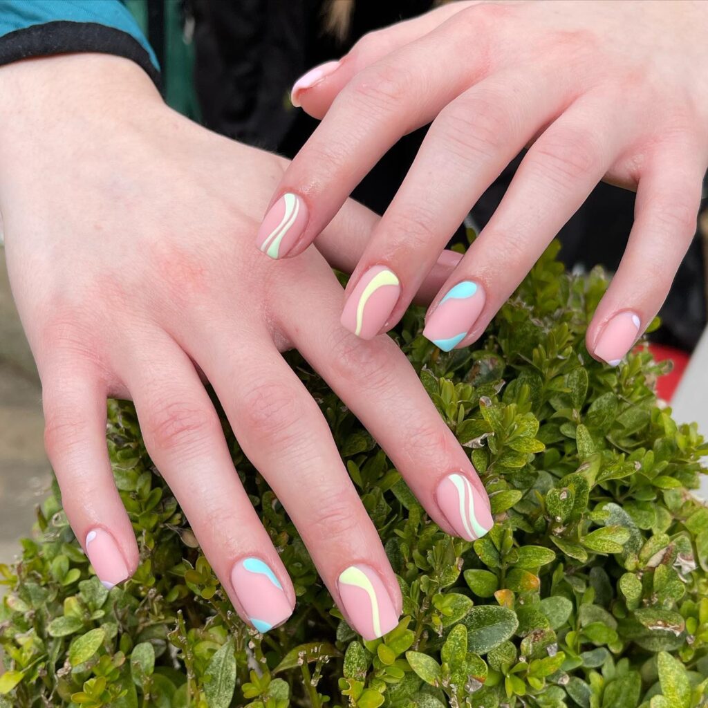 pastel yellow blue and white swirl nails