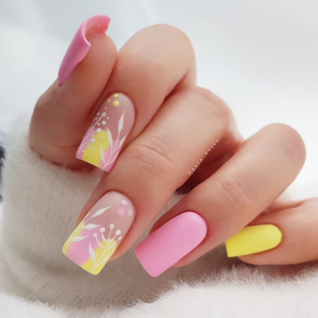 pink and yellow nails with floral art