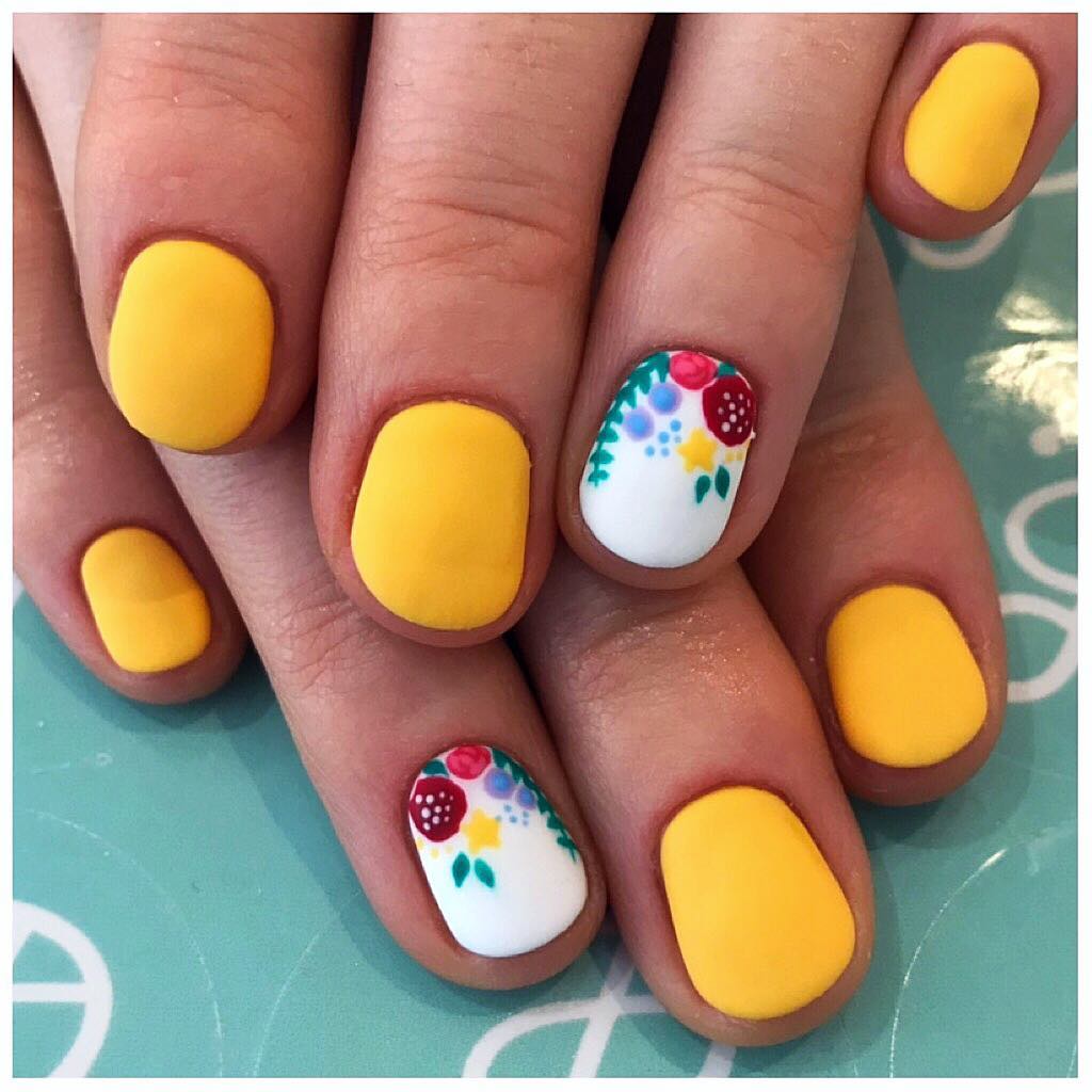 sunshine yellow nails with garden floral accent