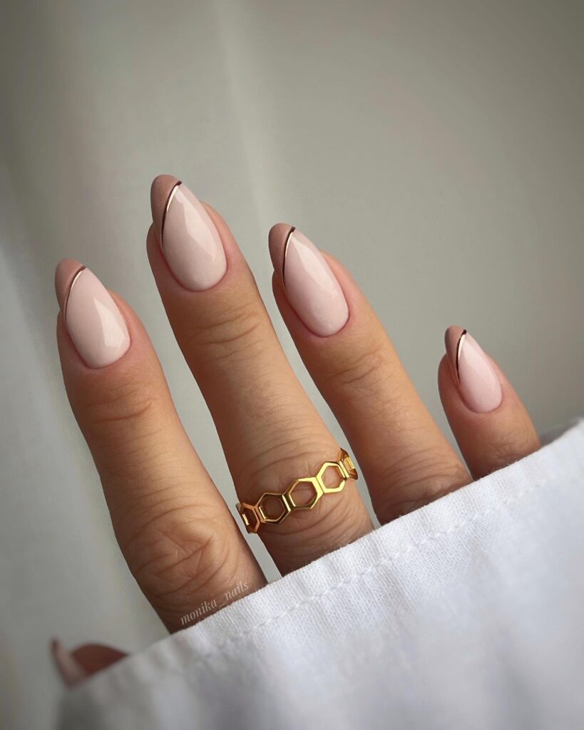 pale blush pink nails with a single thin dark line along each nail edge