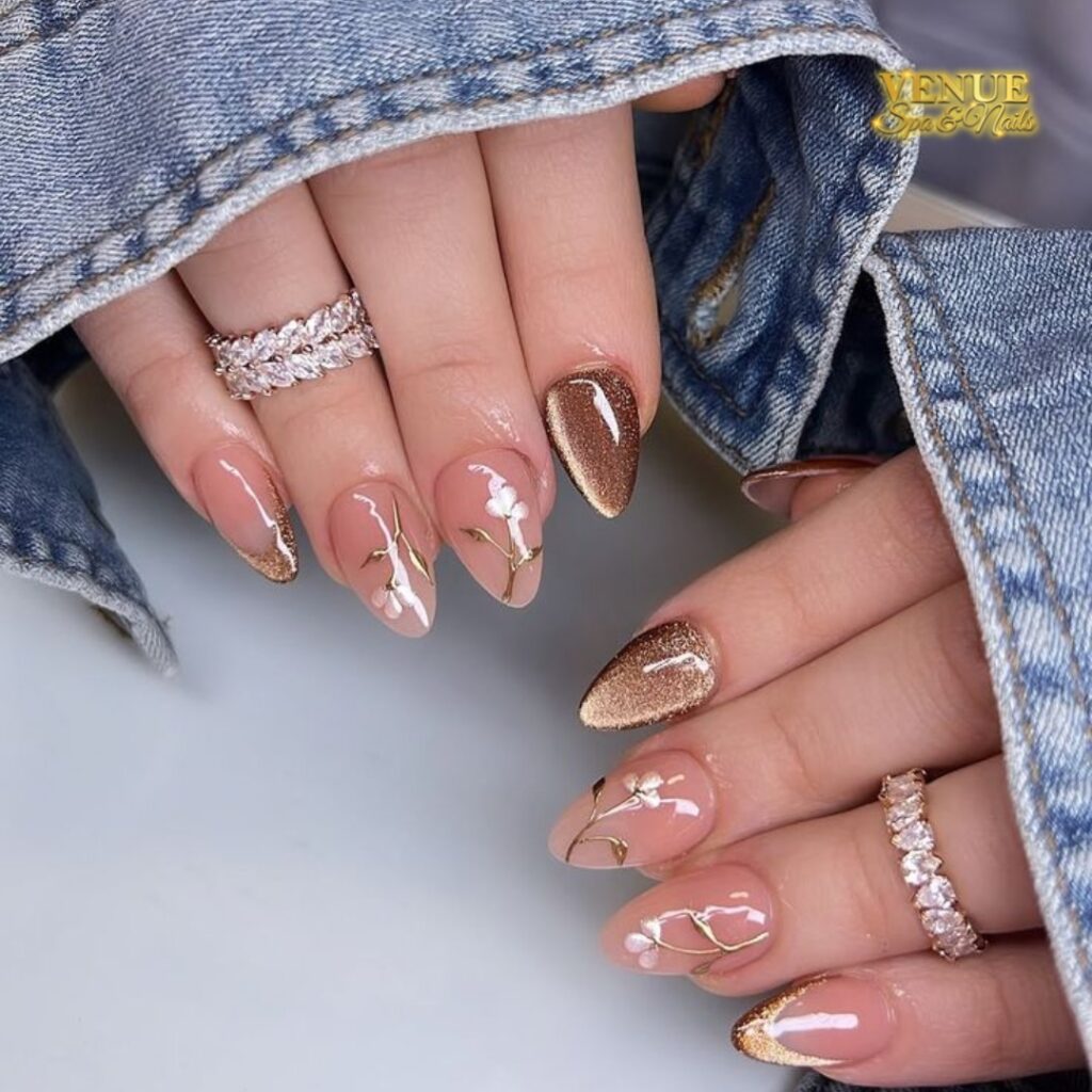 nails mixing bronze glitter with sheer nude and gold botanical nail art