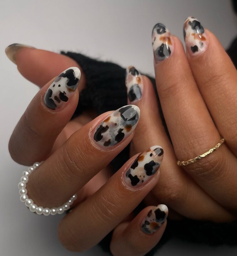 creamy tortoise shell nails with black and brown blended spots