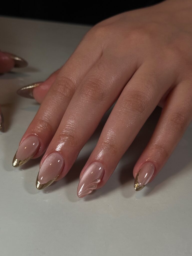 Gold chrome tips with textured shell manicure