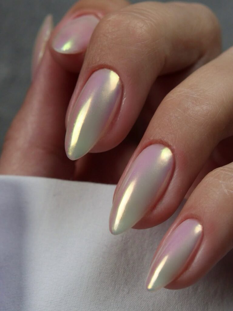 Long stiletto almond nails in sheer iridescent pearl chrome
