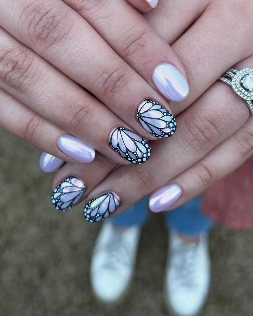 Short oval nails with lavender chrome and black butterfly wing accent art