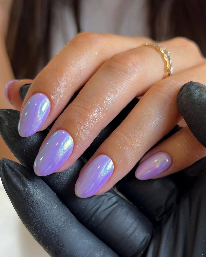 nails in vivid violet with holographic chrome shimmer