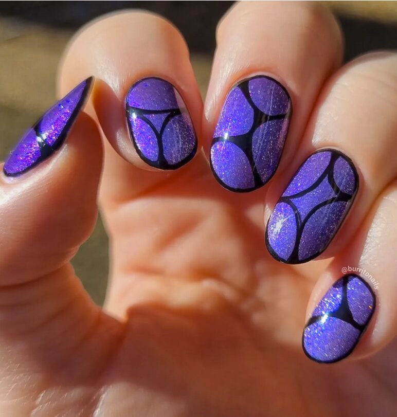 Purple glitter nails with black abstract outline designs
