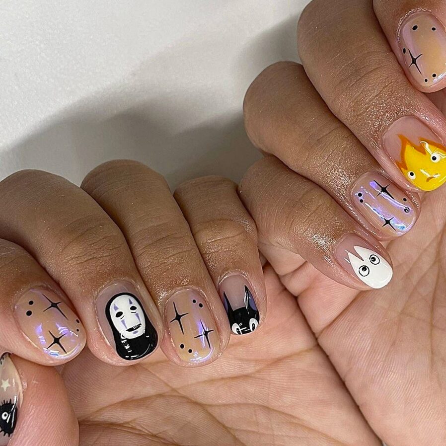 Short nails with hand-painted Studio Ghibli characters and sparkly accents
