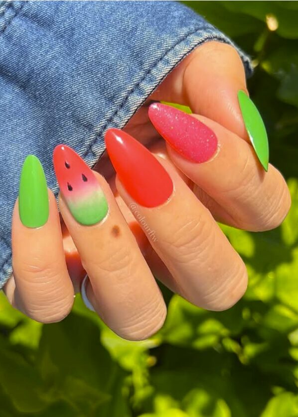 Green and red nails with a watermelon-inspired ombré accent