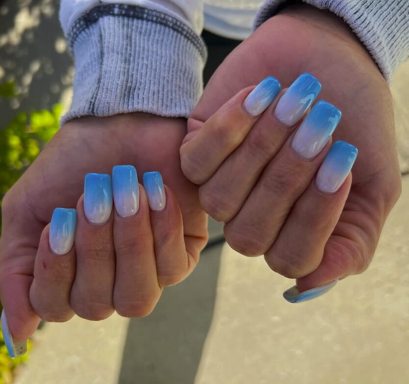nails with a soft gradient from white to sky blue