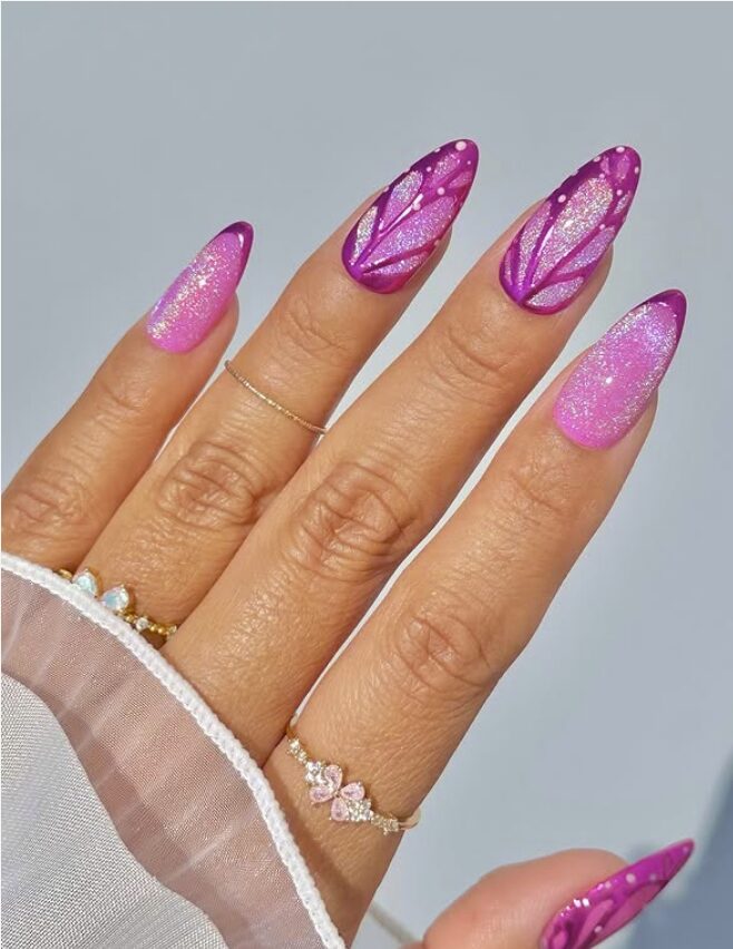 Pink-to-purple glitter nails with bold butterfly wing designs