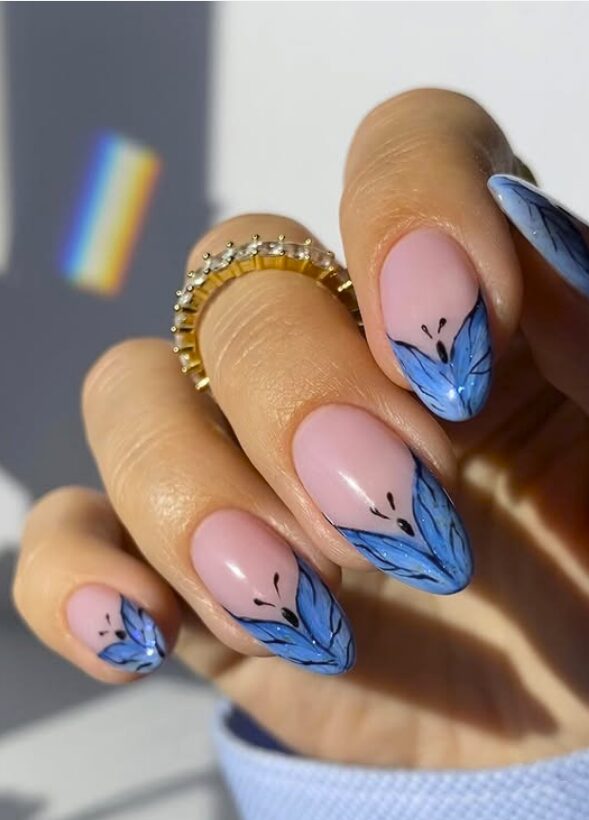Pink nails with blue butterfly wing tip designs