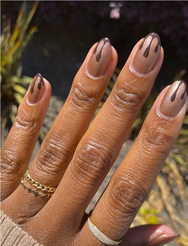 Nude shimmer nails with glossy brown chocolate-drip designs