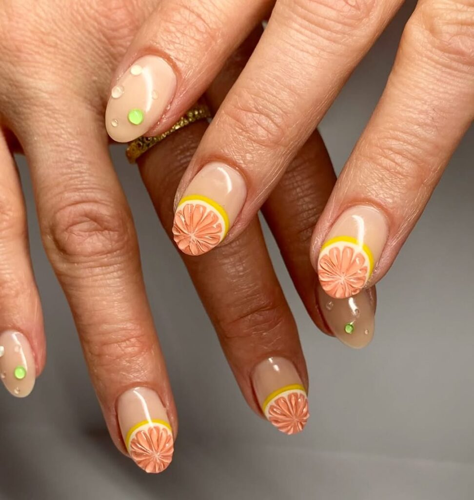 fun citrus fruit slice nail design with lemons and oranges
