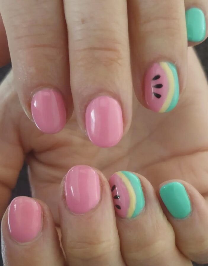 Pink and mint nails with watermelon slice accent designs