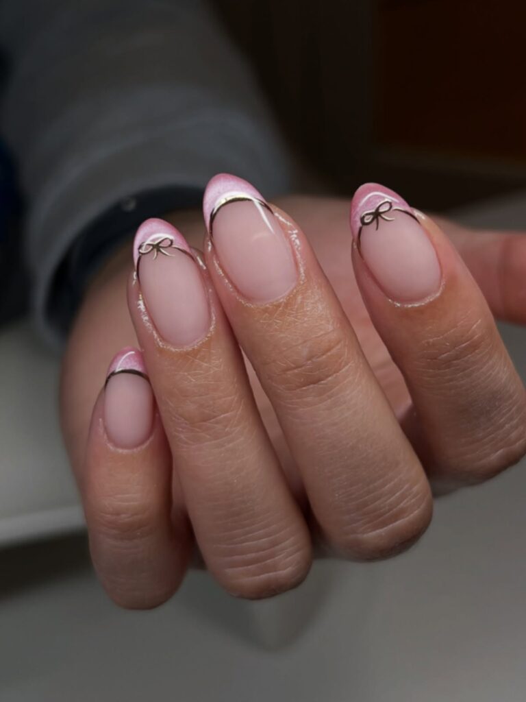 tiny bow accent nails in pink