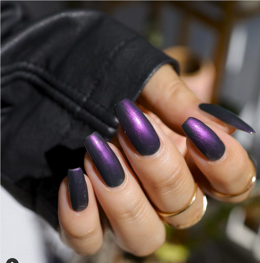Metallic dark purple coffin nails with a reflective shimmer