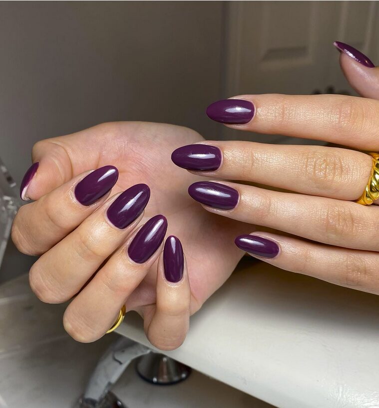 Glossy deep plum almond nails