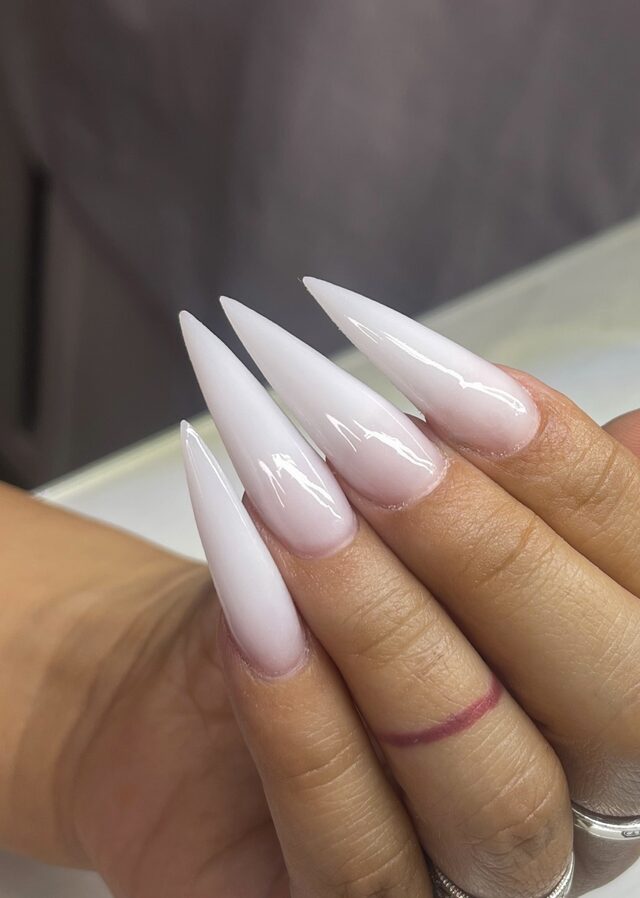 Milky white stiletto nails